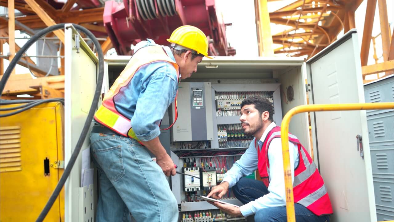 Bothe Electrical Engineer Inspects Electrical Control Board Crane